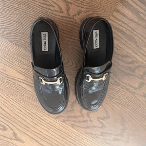 Steve Madden Glossy Black Loafers with Gold Accent